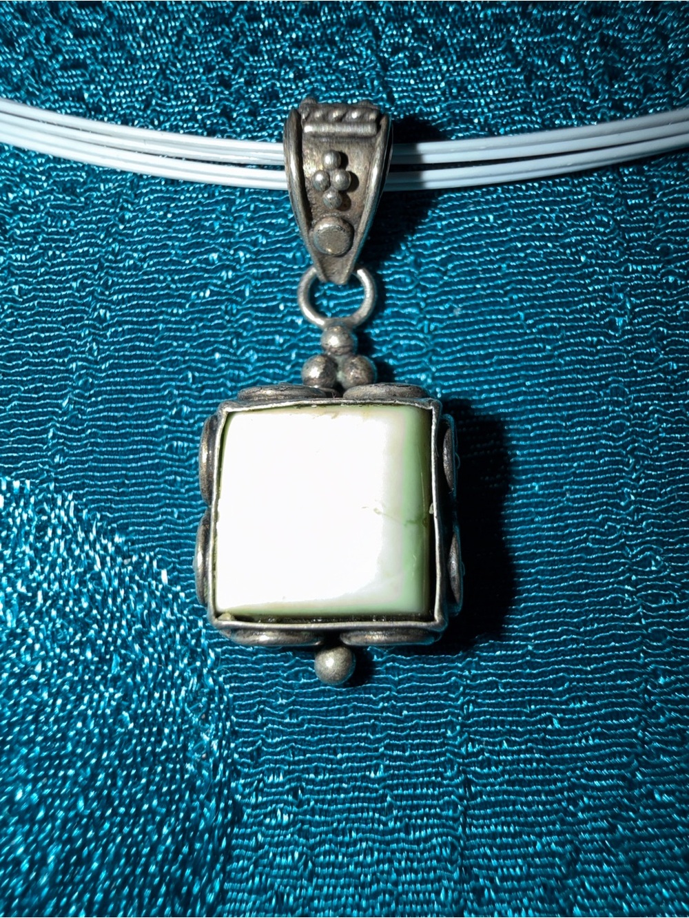 Sterling, silver and light green stone pendant